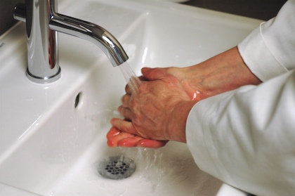 Washing hands at sink